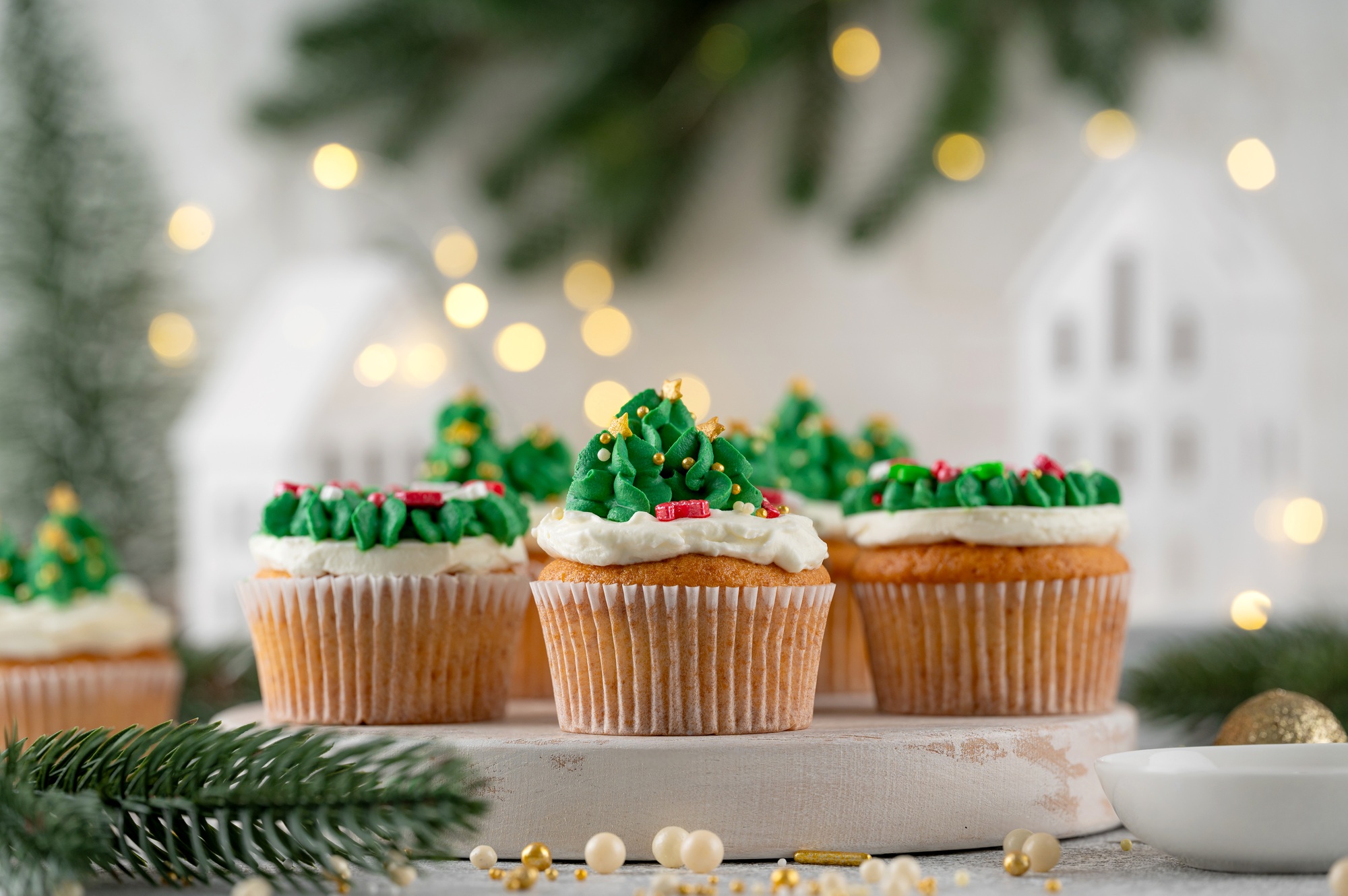 Christmas tree and wreath shaped cupcakes with candy sprinkles on top. Christmas dessert